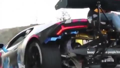 Is it safe for a beautiful woman to sit behind a sports car like this