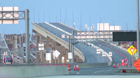 Aftermath of collapsed Baltimore bridge as day breaks