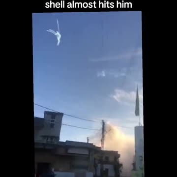 A man in Al-Khayaam village captures the moment white phosphorus shell almost hits