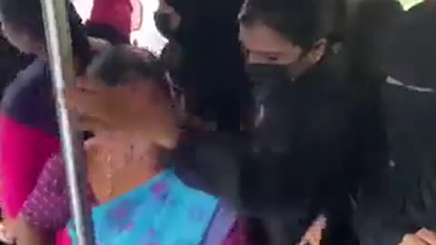 Muslim women force a Hindu woman to cover her head - WTF