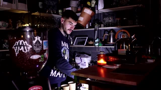 Kyiv coffee shop battles on by defying power cuts