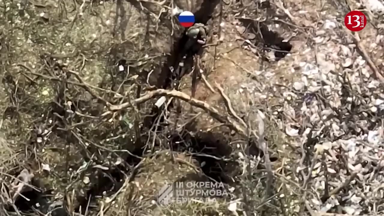 Drone captures large number of surviving Russians surrender to Ukrainian soldiers in a trench