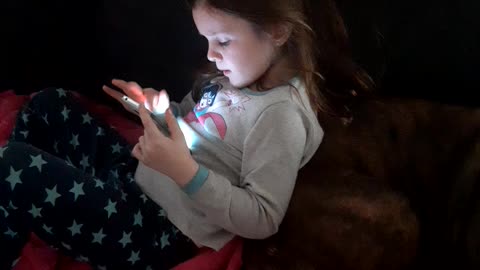 Playing on her phone