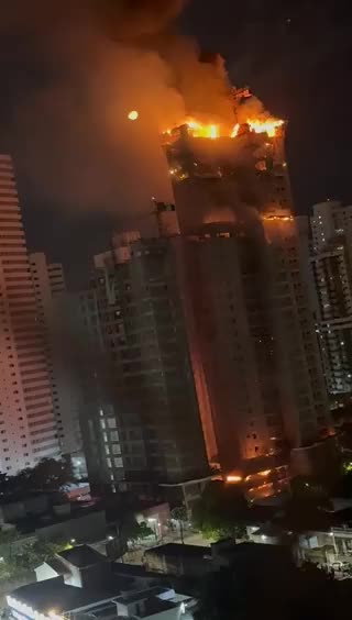 A colossal blaze sweeps through a tall building still under construction in Recife, Brazil.