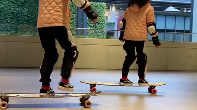 The twins not only look the same, but also practice skateboarding