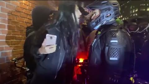 A young woman was arrested after she screamed, “F–k you, fascist,”