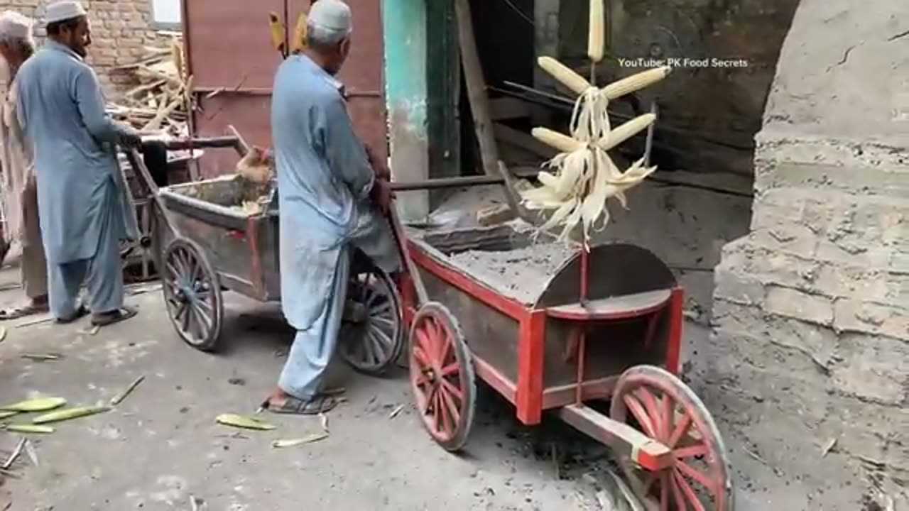 Cooking corn in Sand