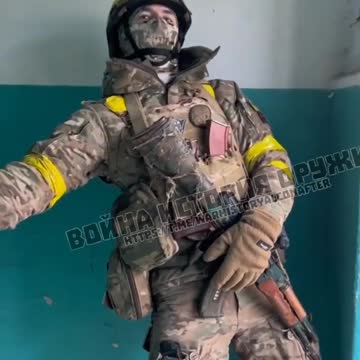 Ukraine soldiers hide in a residential building in Artemovsk