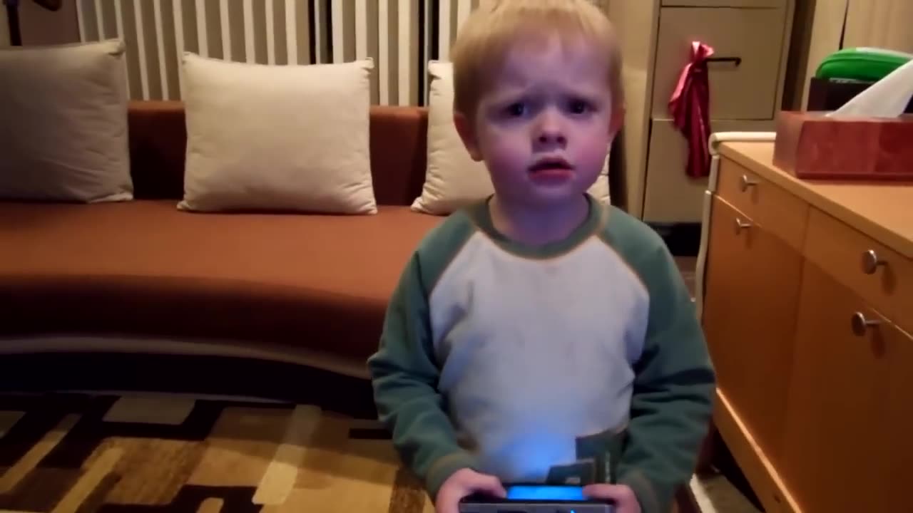 Toddler makes angry face when he dances