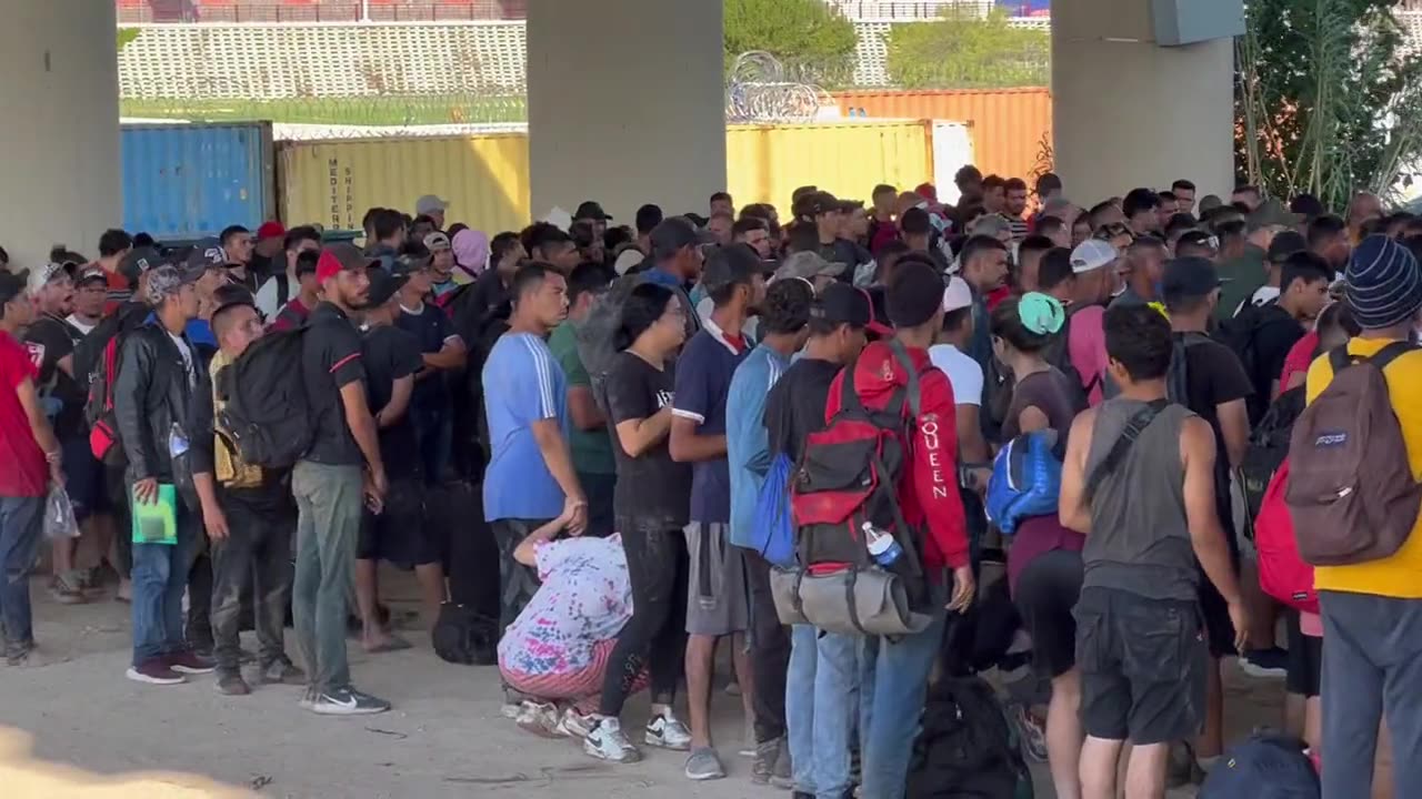 Massive groups of adult men are waiting to be processed by Border Patrol.