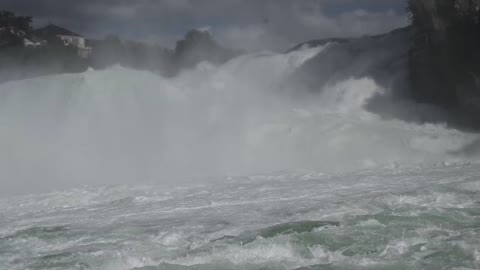 Tourist In The View Deck Looking At The Strong Force Of A River