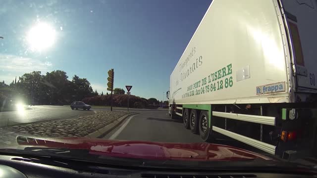 Biker Close Call in Roundabout