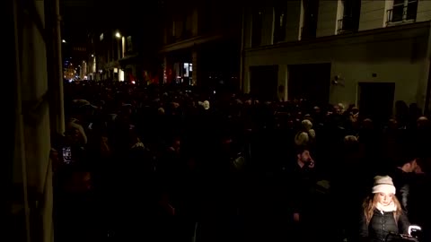 People light candles at scene of Paris shooting