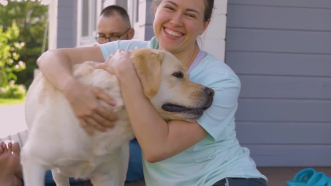 Woman Hugging a Dog