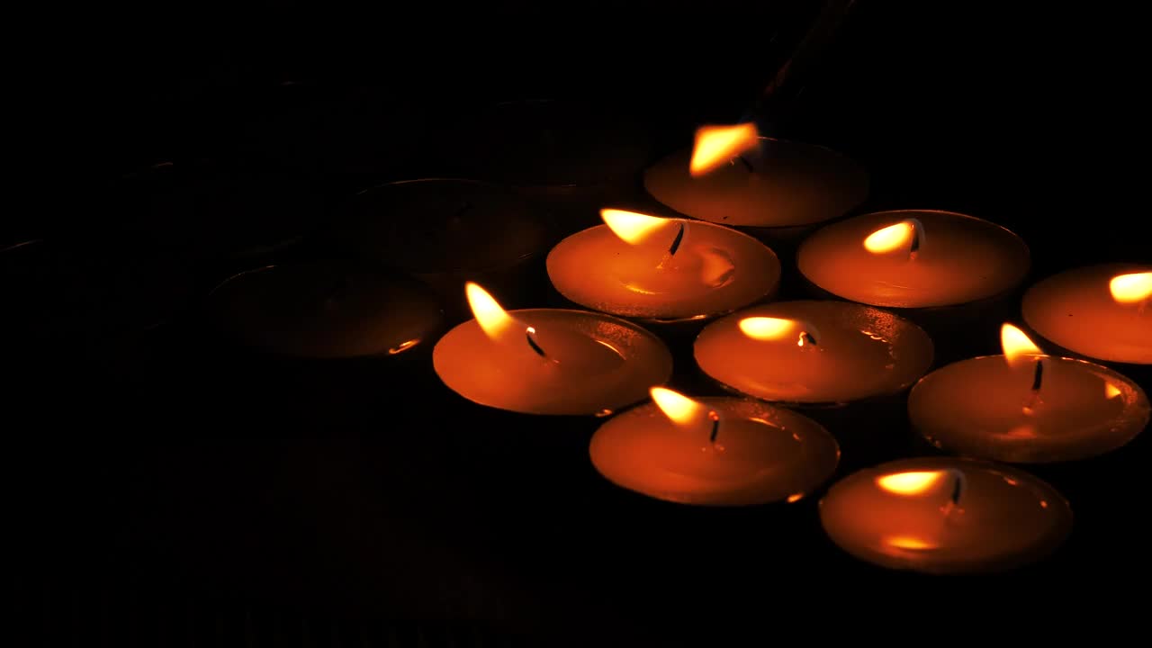 Lighting candles in the dark