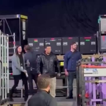 Taylor and Travis hold hands as they depart stage in Amsterdam