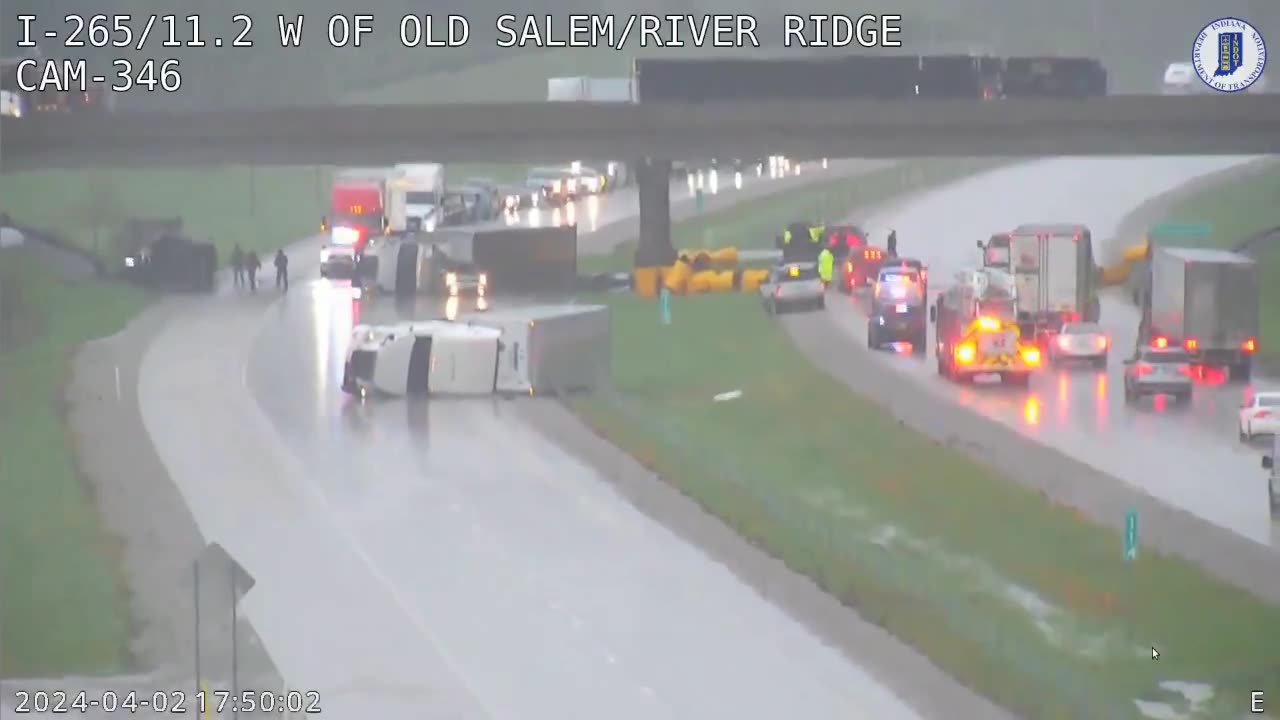 Multiple flipped semis and cars on I-265 near Utica