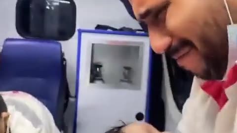Gaza Emergency Worker Breaks Down in Tears Cradling a Baby in an Ambulance