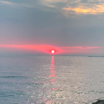 The atmosphere during a sunset often feels calm and serene, inviting contemplation and reflection