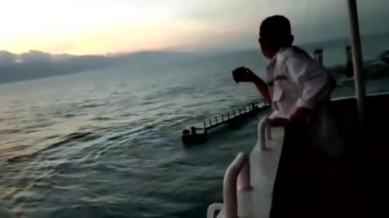 EARTHQUAKE AND TSUNAMI POV FROM VESSEL ALONGSIDE JETTY