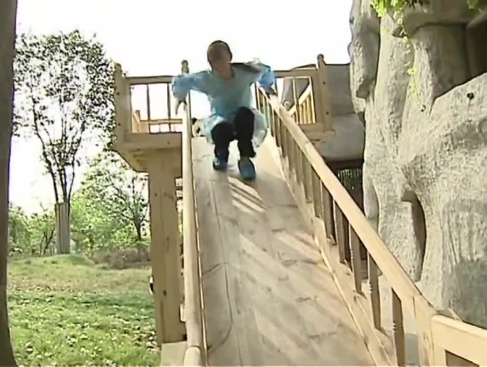 Cute pandas playing on the slide