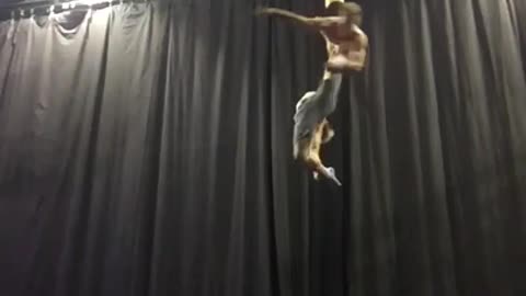 Guys Display Amazing Performance While Hanging From Ceiling In Aerial Straps
