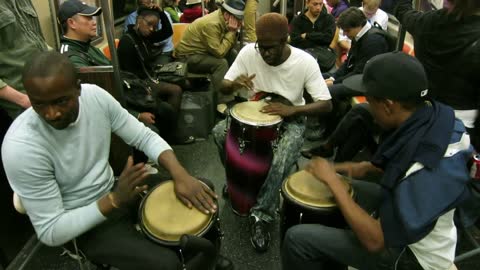 A Slice of NYC Life: Conga drum trio playing on the A train