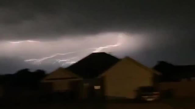 Lightning Strike Over Houses During A Storm