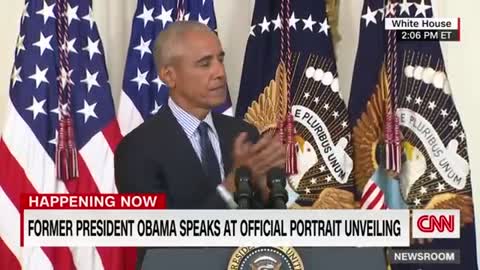 Barack Obama gives a speech after the unveiling of his White House portrait