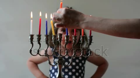 Small little baby girl playing with candles