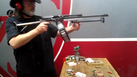 Full auto open bolt Saiga-12 shotgun with drum mag.