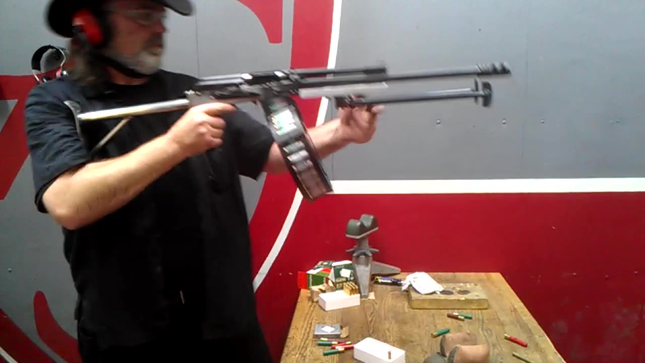 Full auto open bolt Saiga-12 shotgun with drum mag.