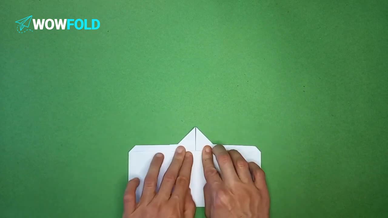 White Cloud - folding a paper airplane