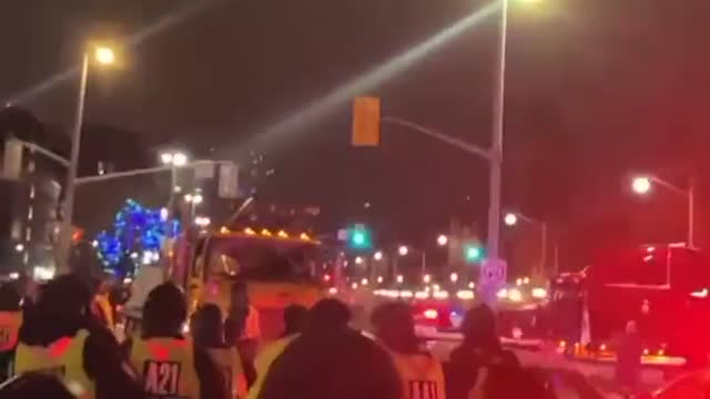 The police in Ottawa try to blockade but the people push them back