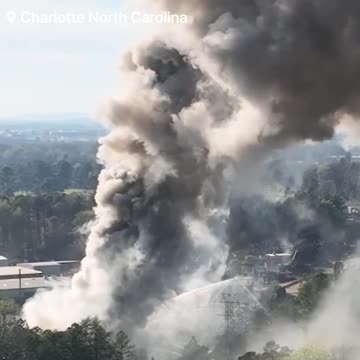 A massive metal scrap yard fire is being fought by firefighters in Charlotte North Carolina