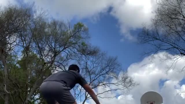 Guy Makes Basketball Trickshot While Balancing on Stability Ball