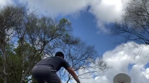 Guy Makes Basketball Trickshot While Balancing on Stability Ball