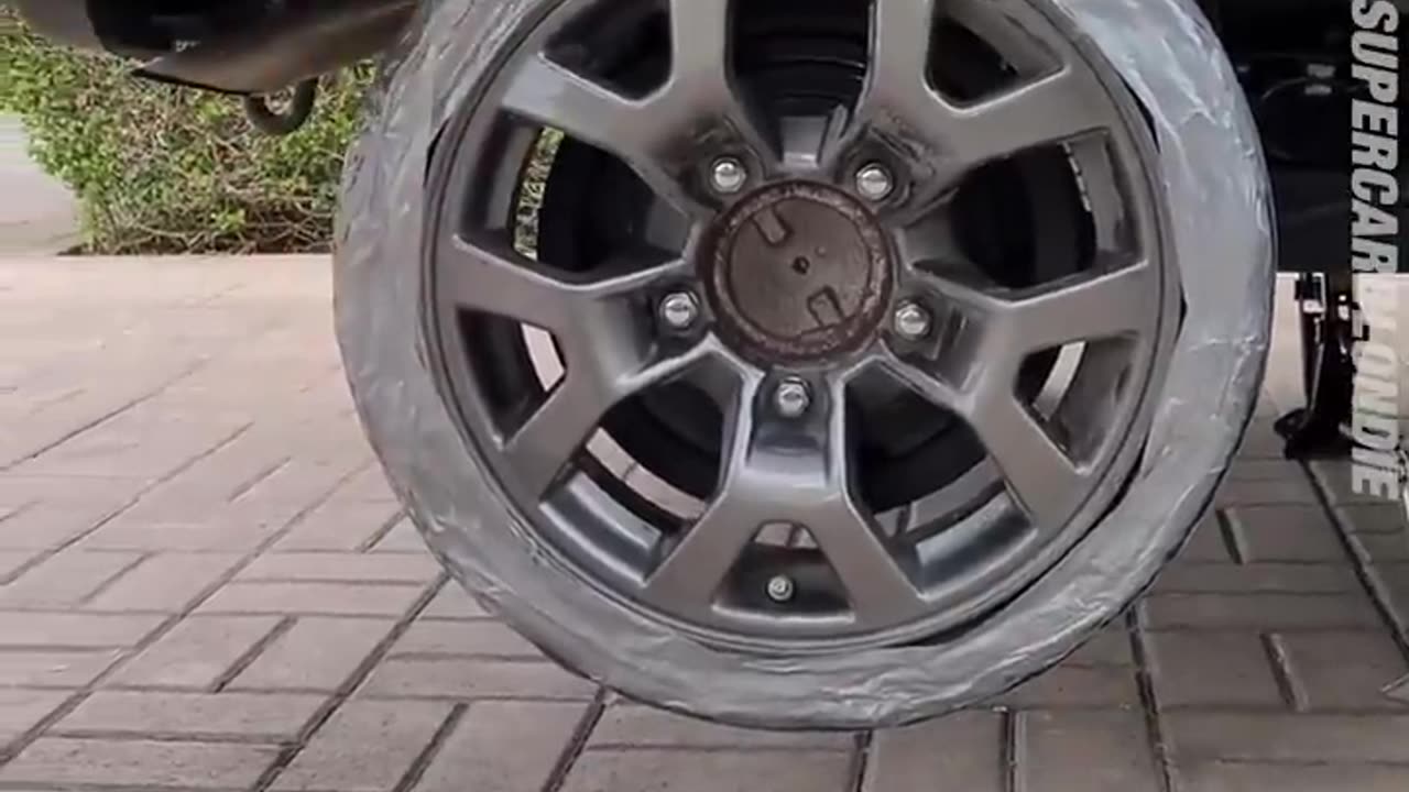 Changing a tire with over 100 rolls of duct tape 🤣😂