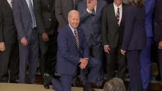 Joe Biden takes a knee for Golden State Warriors photo