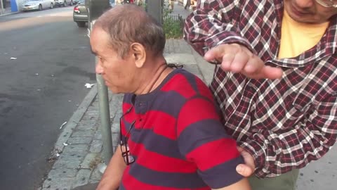 Luodong Massages Old Man On Sidewalk