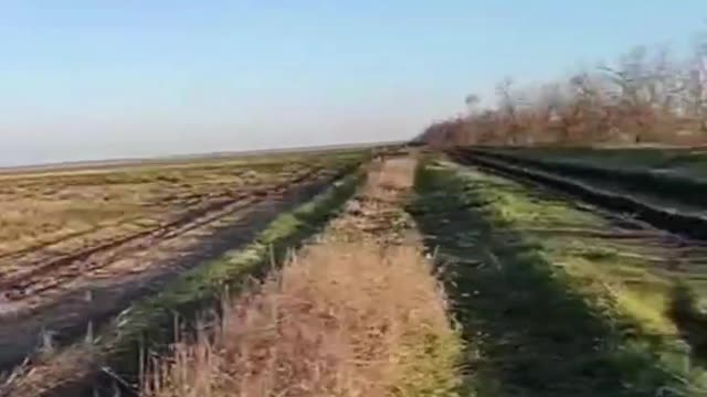 A Russian cruise missile passes over V.S.U. soldiers in the Zaporozhye region.