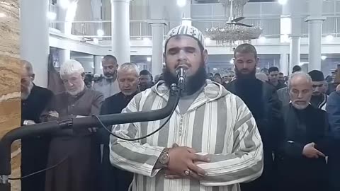 A cat playing with the imam in the mosque during prayer is making headlines.