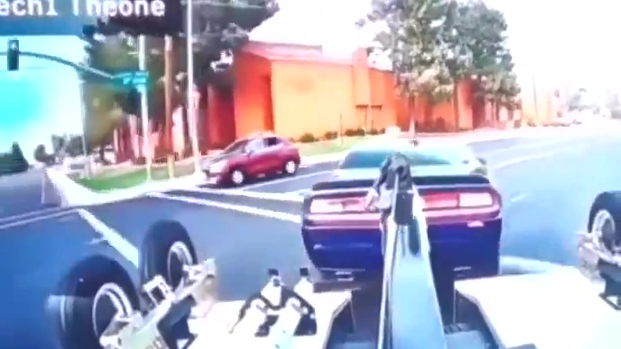 Dude steals his own car off the back of a moving tow truck