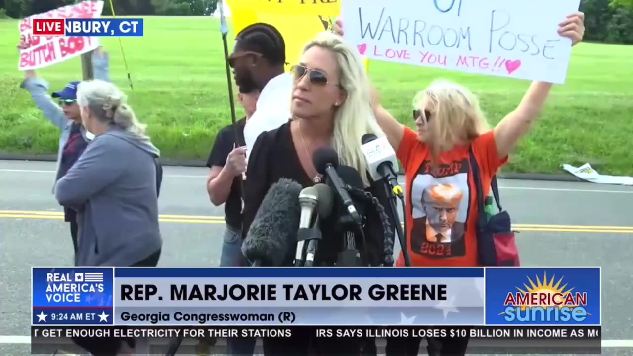 Marjorie Taylor Greene interrupted by protest outside Bannon's prison