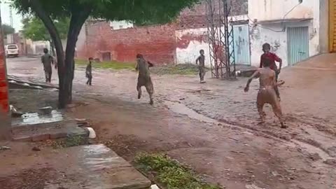 Childs playing in rain