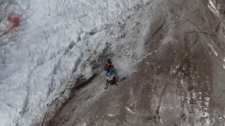 Pinned Under Snowmobile During Race