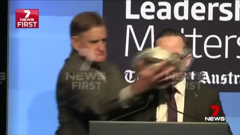 Australian politician gets pied in the face during speech