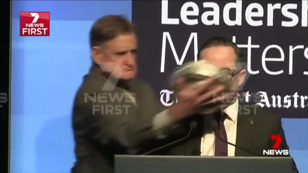 Australian politician gets pied in the face during speech