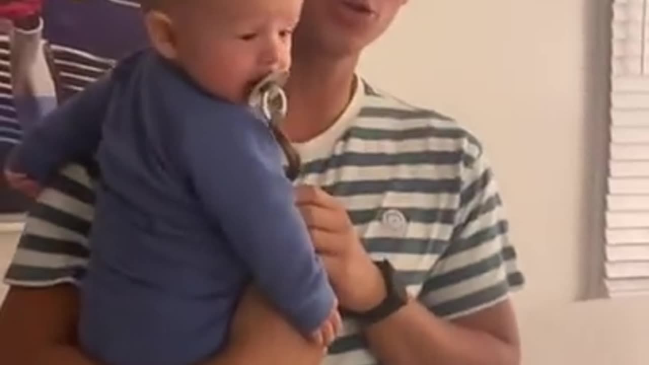 checking the reaction of her son after she cuts her hair