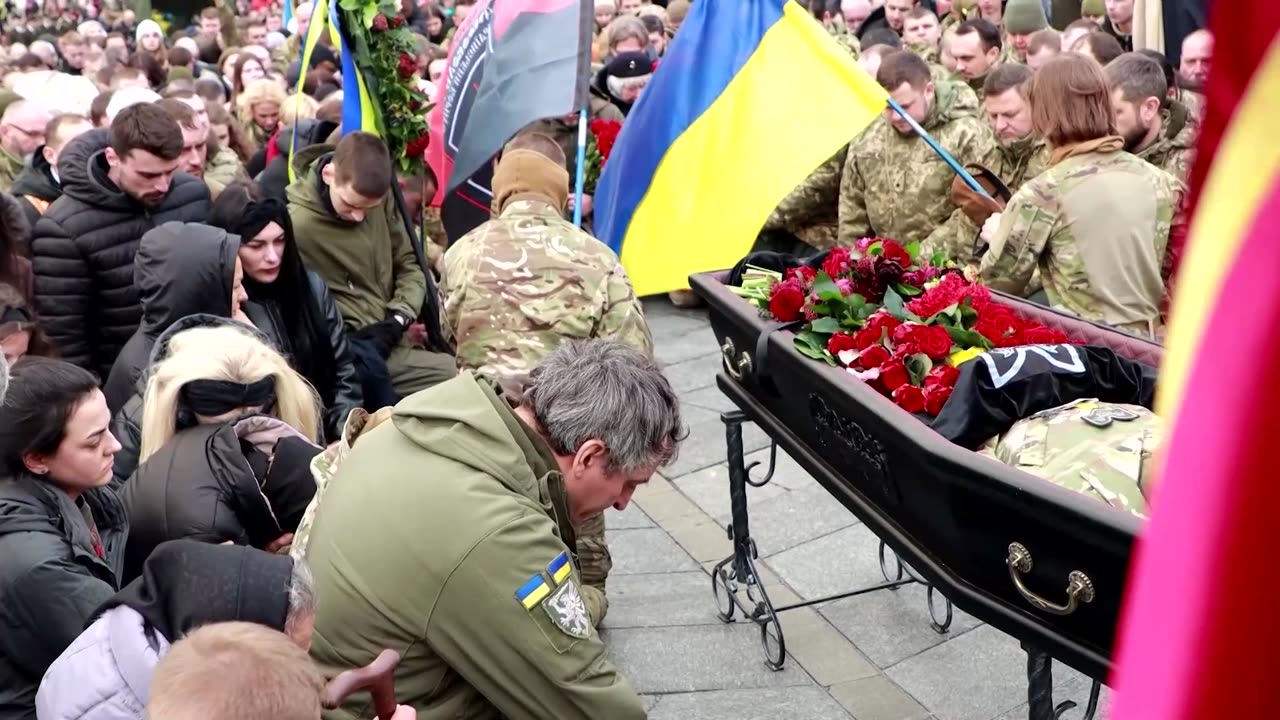 Zelenskiy leads tribute for deceased Ukrainian fighter